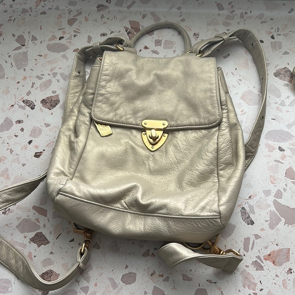 Super cute leather backpack in silver/champagne color